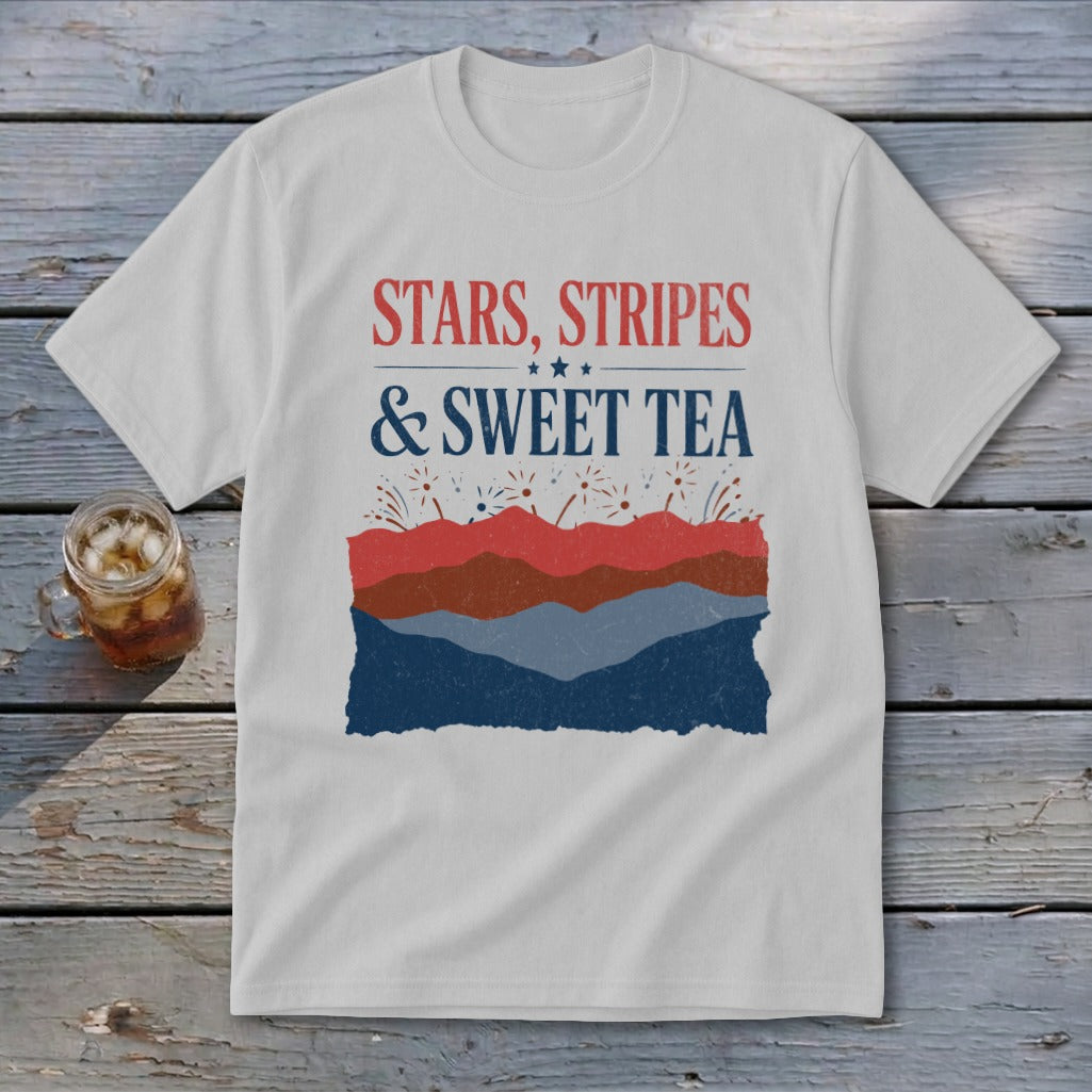 Light gray t-shirt with red, white, and blue text reading Stars, Stripes & Sweet Tea above abstract mountain layers.