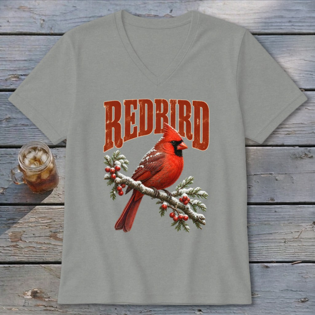A grey V-neck t-shirt featuring a graphic of a red cardinal on a snowy branch with red berries and the text Redbird above it.