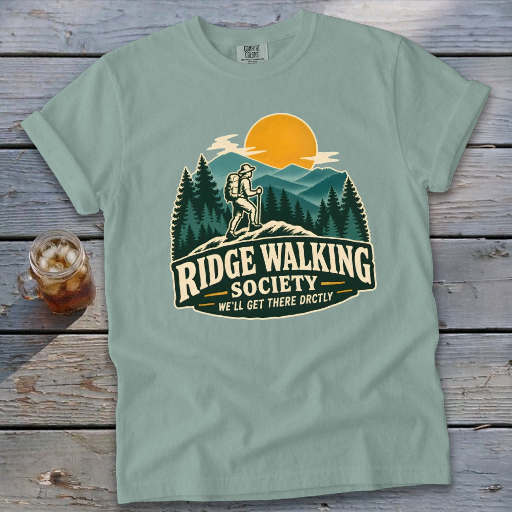 Light teal t-shirt with "Ridge Walking Society" hiker graphic and text.
