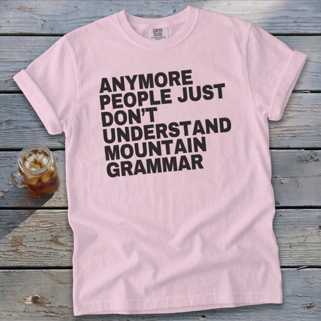 Pink t-shirt with black text reading "Anymore people just don't understand mountain grammar".