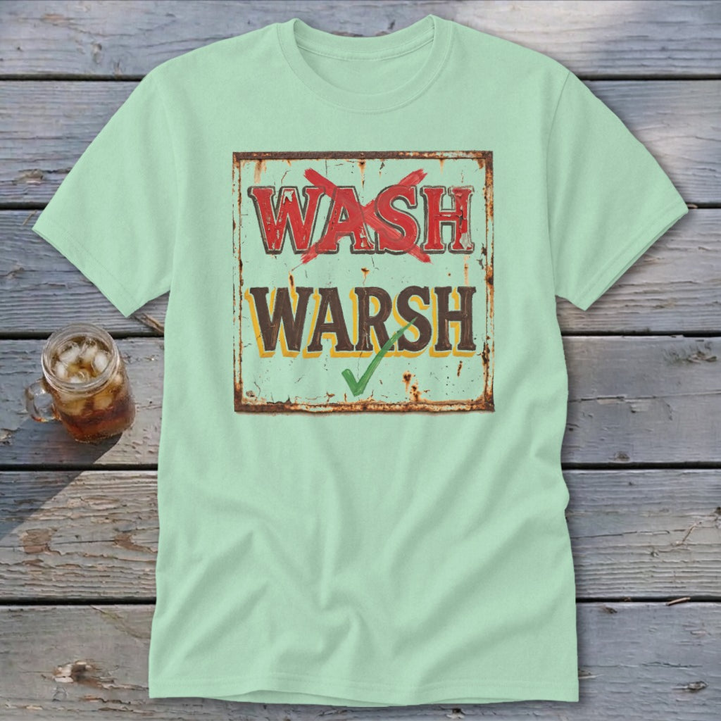 A light green crewneck t-shirt featuring a distressed vintage sign graphic with the words "WASH" crossed out in red and "WARSH" checked in green.