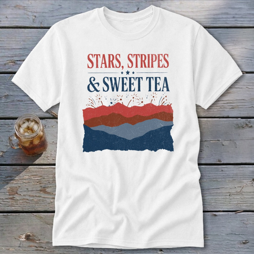 A white short-sleeve t-shirt features red and blue graphic text reading Stars, Stripes, & Sweet Tea above layered patriotic mountain silhouettes.