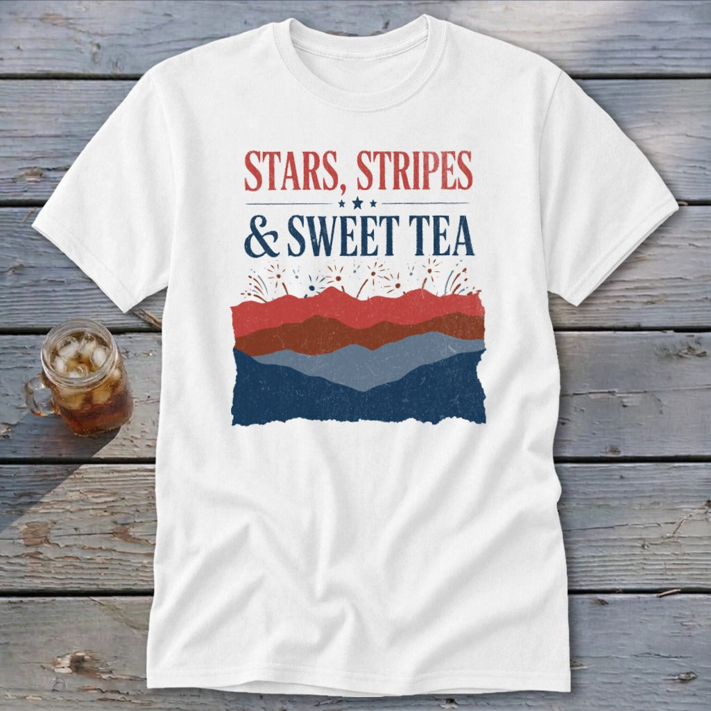 A white short-sleeve t-shirt features red and blue graphic text reading Stars, Stripes, & Sweet Tea above layered patriotic mountain silhouettes.