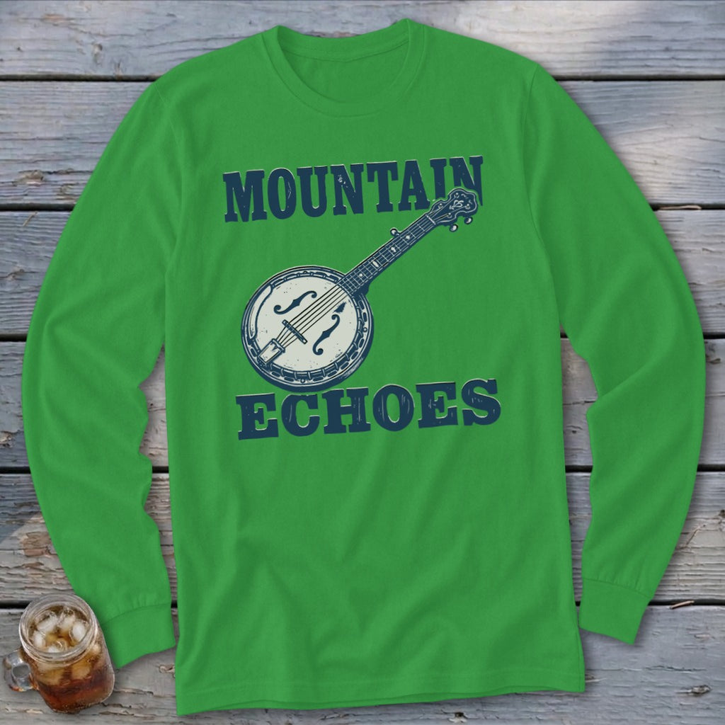Green long-sleeve shirt with a banjo graphic and the text Mountain Echoes on a wooden background.