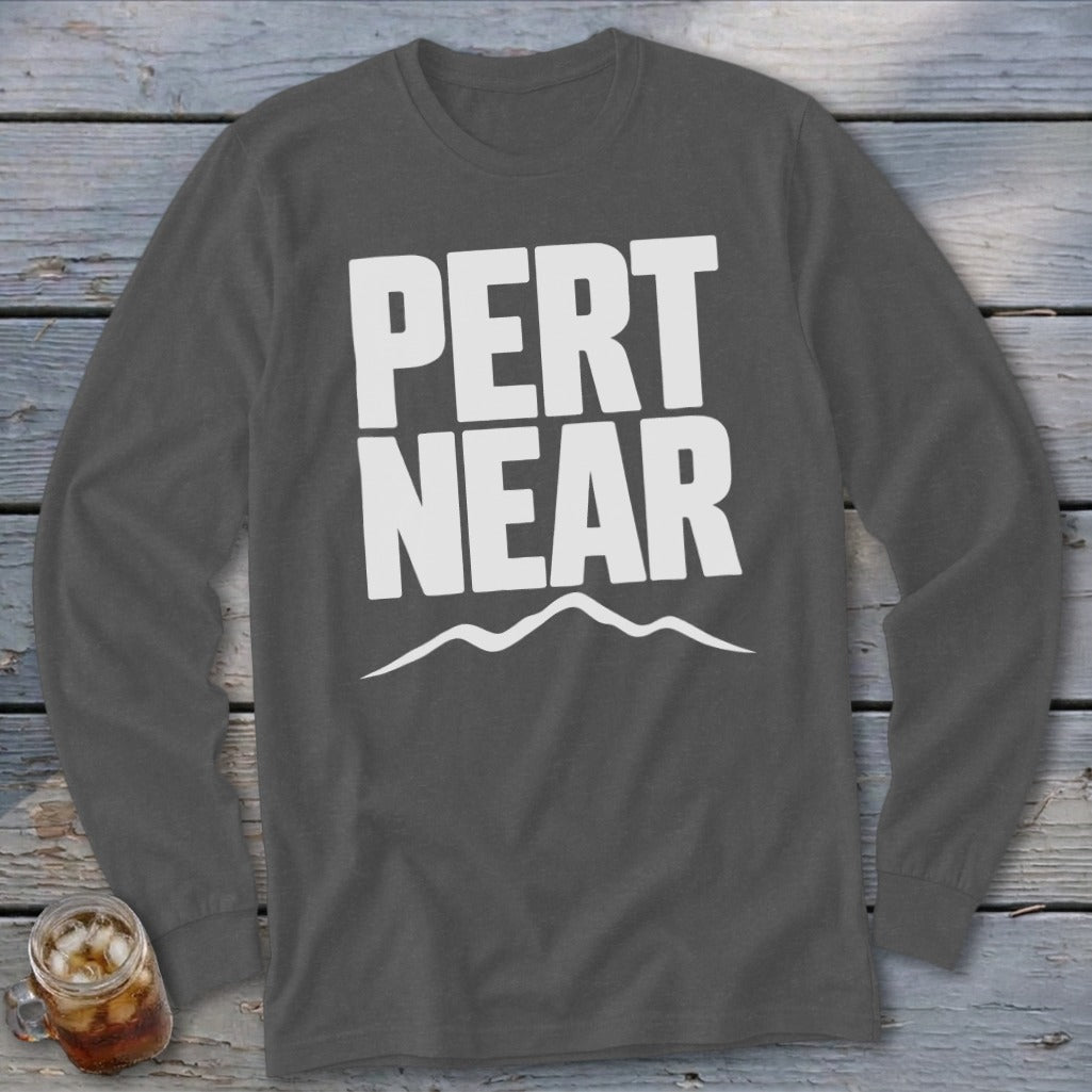 Charcoal grey long-sleeve t-shirt with white text that reads "PERT NEAR" above a mountain silhouette.