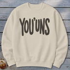 Cream sweatshirt with "YOU'UNS" in dark gray block lettering.