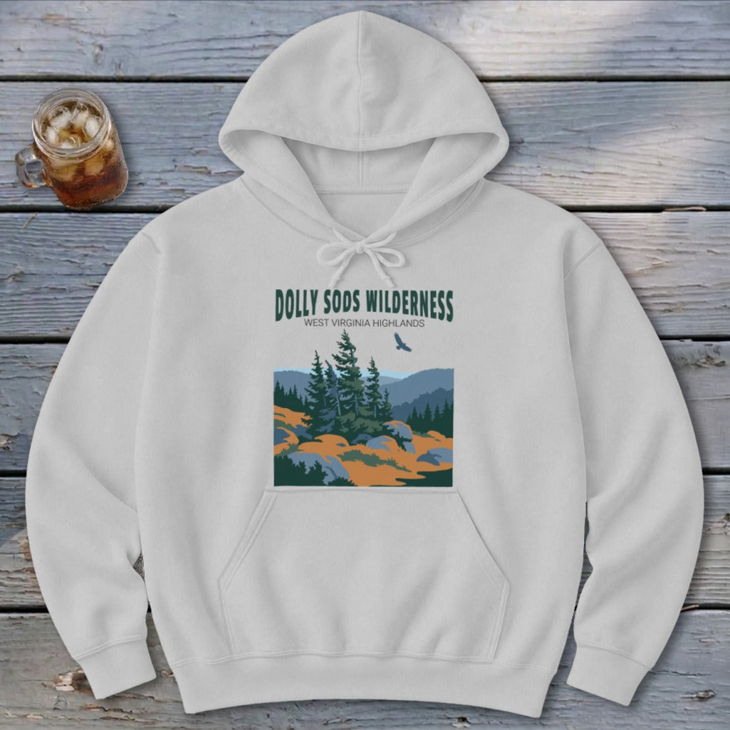 A light gray hooded sweatshirt featuring a Dolly Sods Wilderness graphic on a rustic wooden surface.