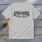White t-shirt with "APPALACHIA #New York" printed on it.