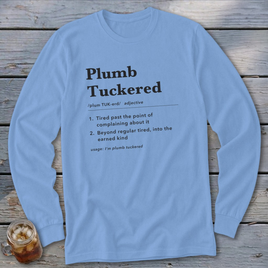 Light blue long sleeve shirt with "Plumb Tuckered" definition printed in black text.