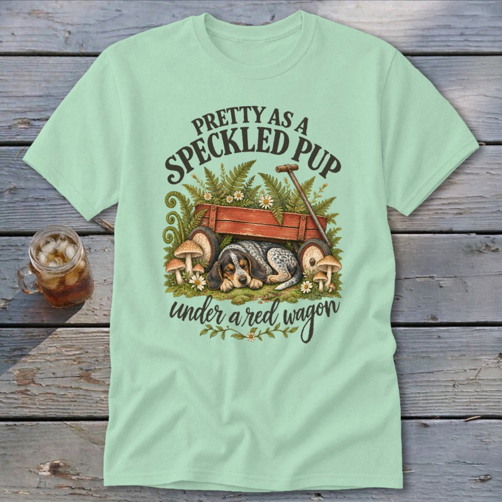 T-shirt with Speckled Pup sleeping under a red wagon graphic.