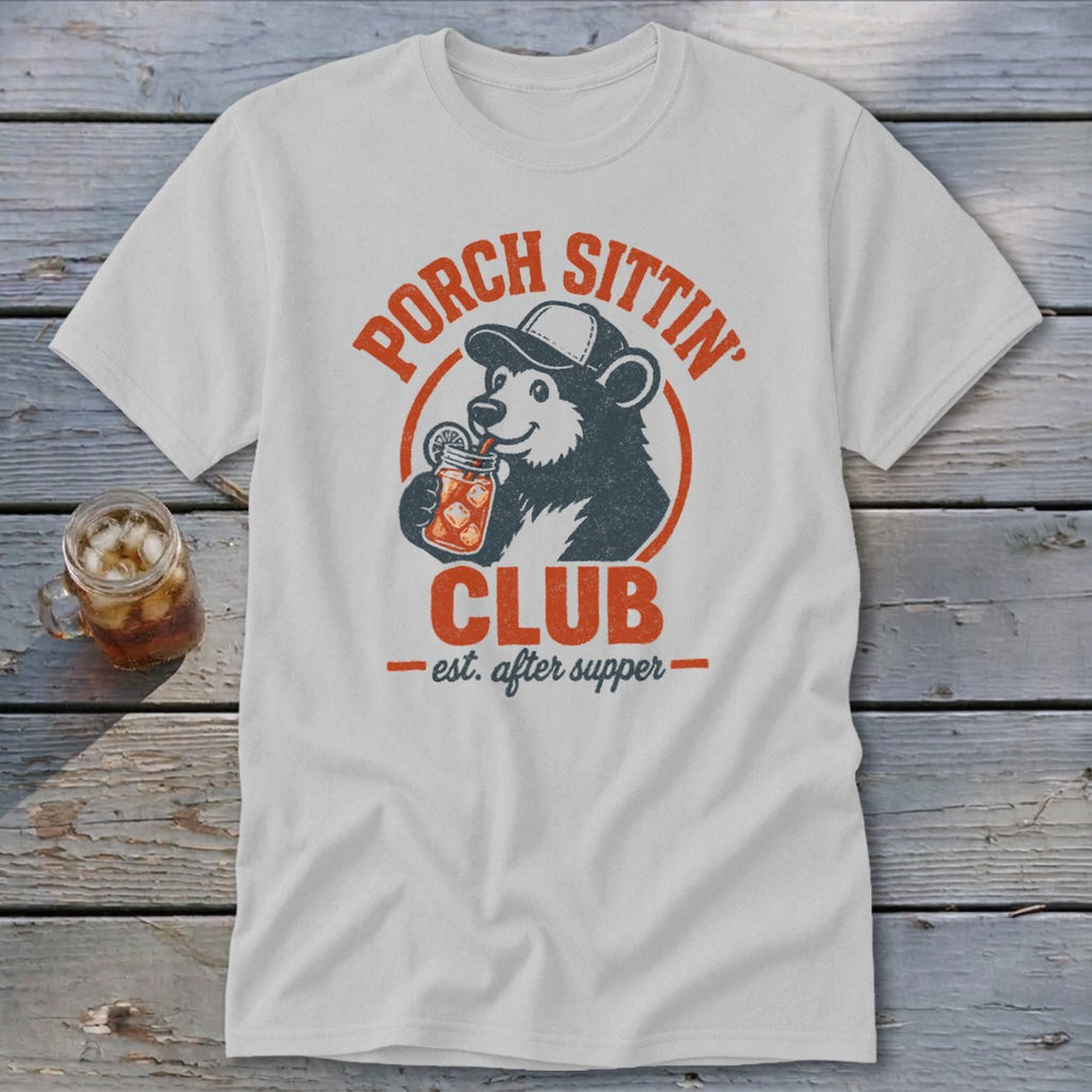 White t-shirt with distressed graphic of bear in hat drinking from jar, "Porch Sittin' Club" text.