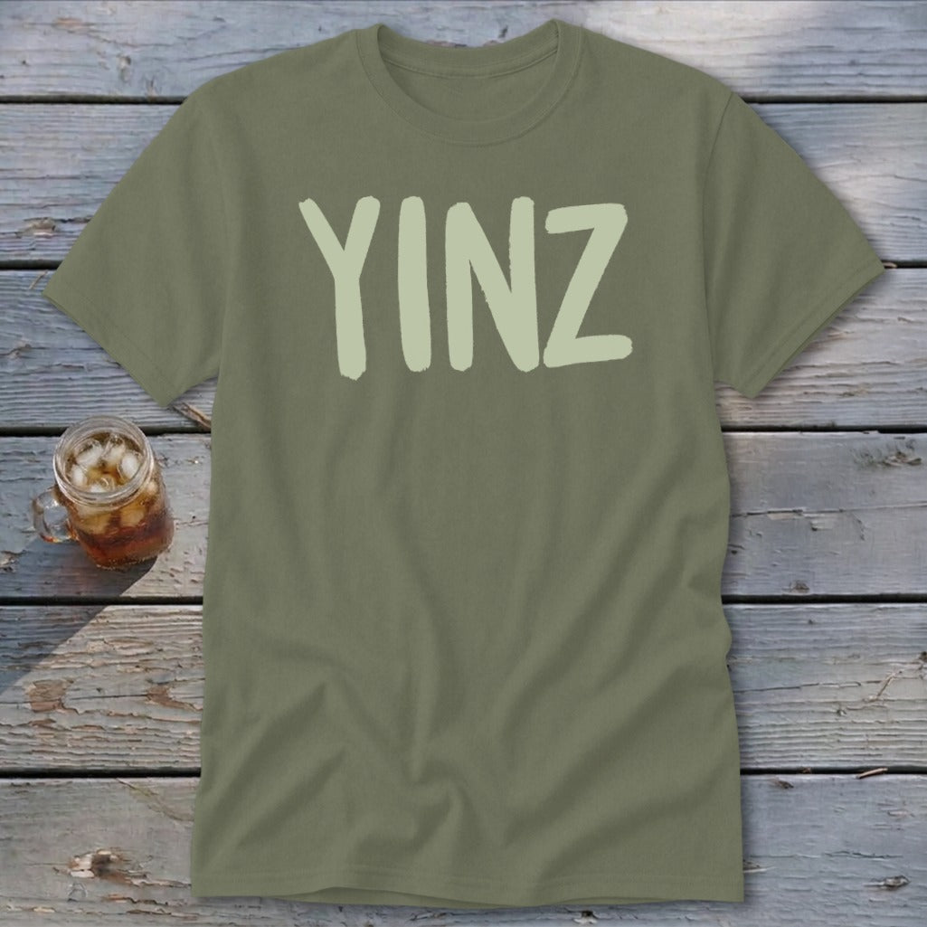 Olive green t-shirt with "YINZ" in pale green block letters.