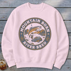 Pink sweatshirt with circular graphic of a jumping trout, text "Mountain Born River Bred."
