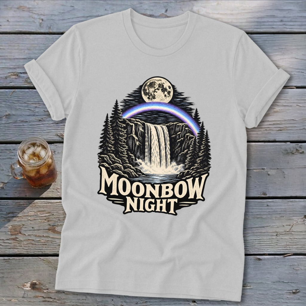 White t-shirt with a waterfall, moon, moonbow, and trees graphic with text "Moonbow Night".