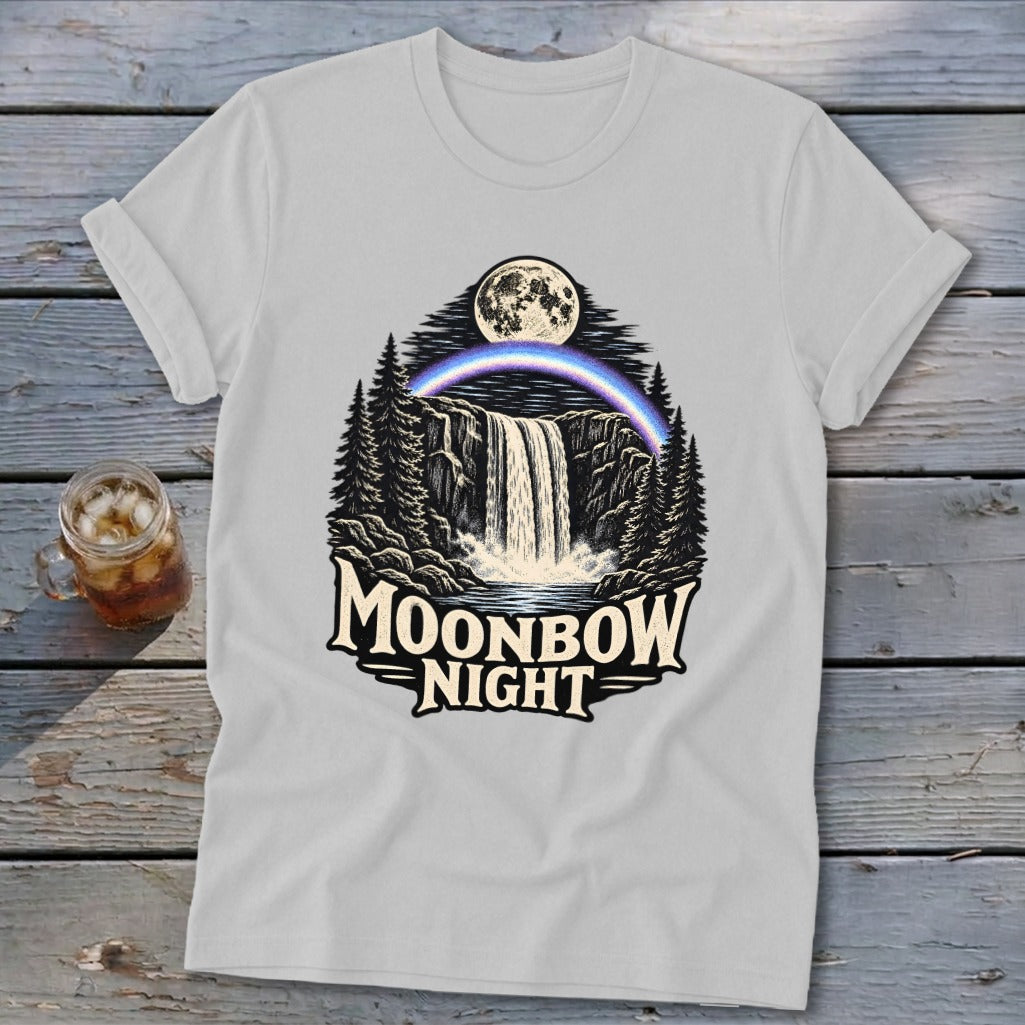 White t-shirt with a waterfall, moon, moonbow, and trees graphic with text "Moonbow Night".