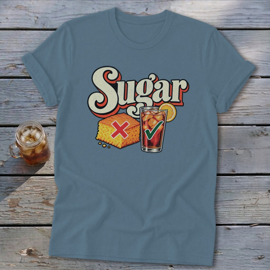 A steel blue t-shirt printed with the word Sugar, a cornbread square marked with a red X, and an iced tea with a green checkmark.