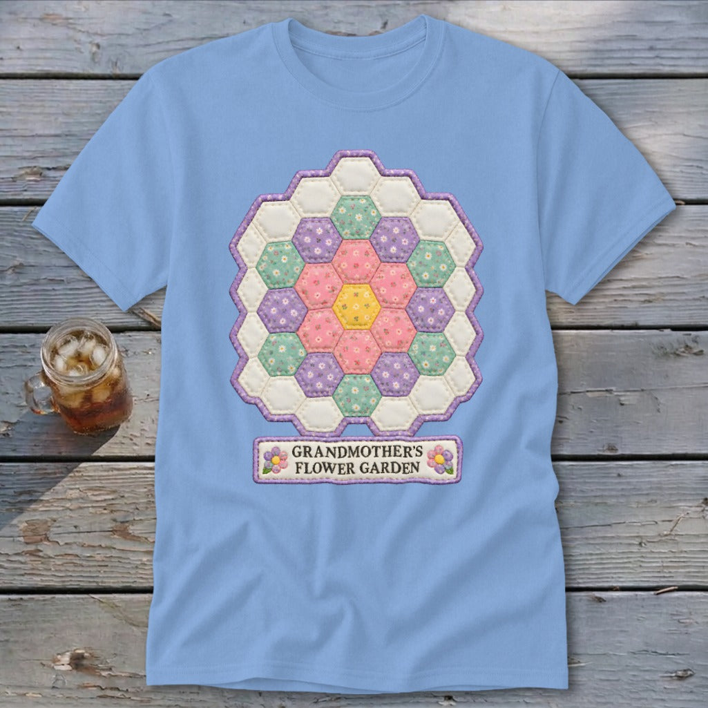 Light blue t-shirt with a hexagonal quilt design and "Grandmother's Flower Garden" text.