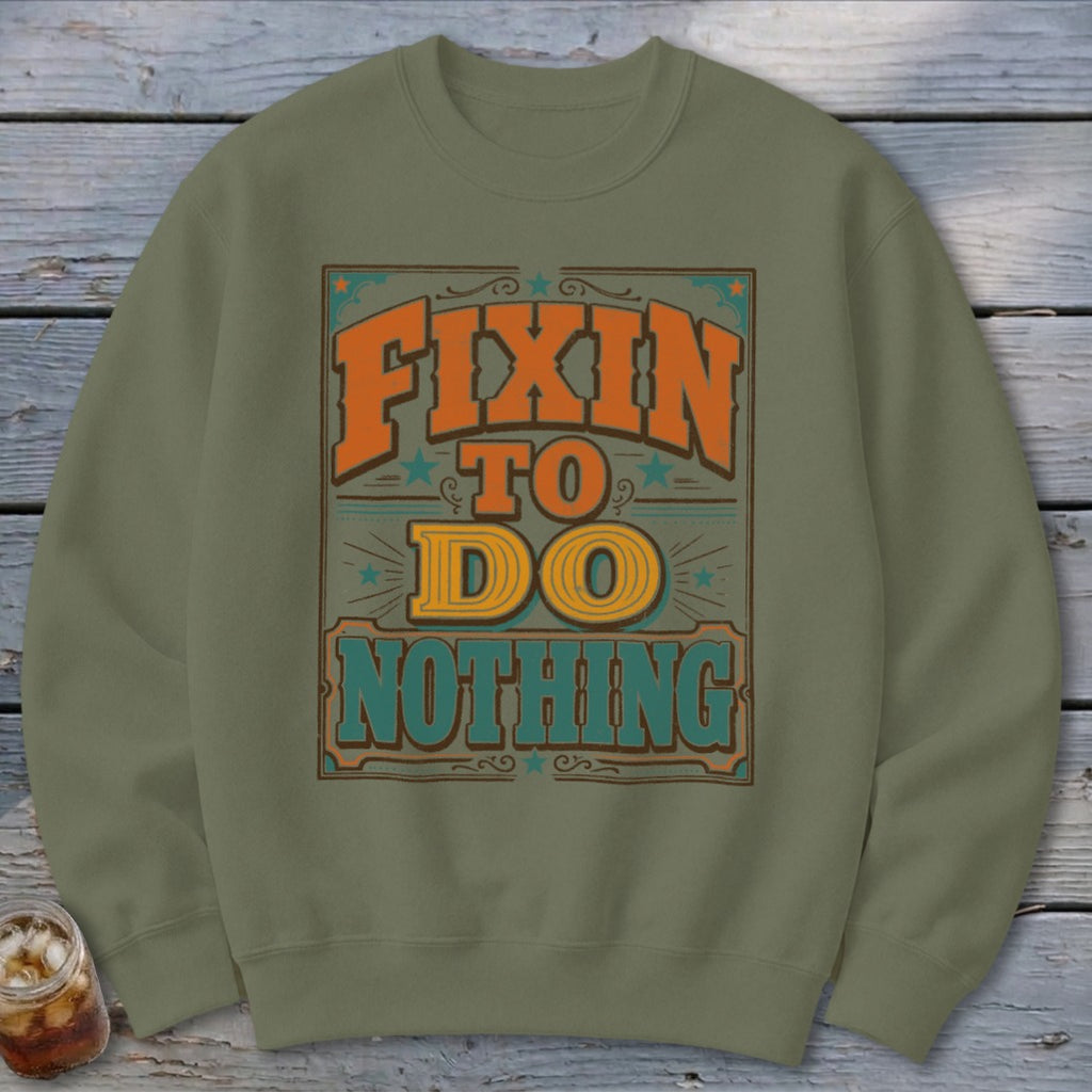 Green sweatshirt with "Fixin to Do Nothing" graphic.