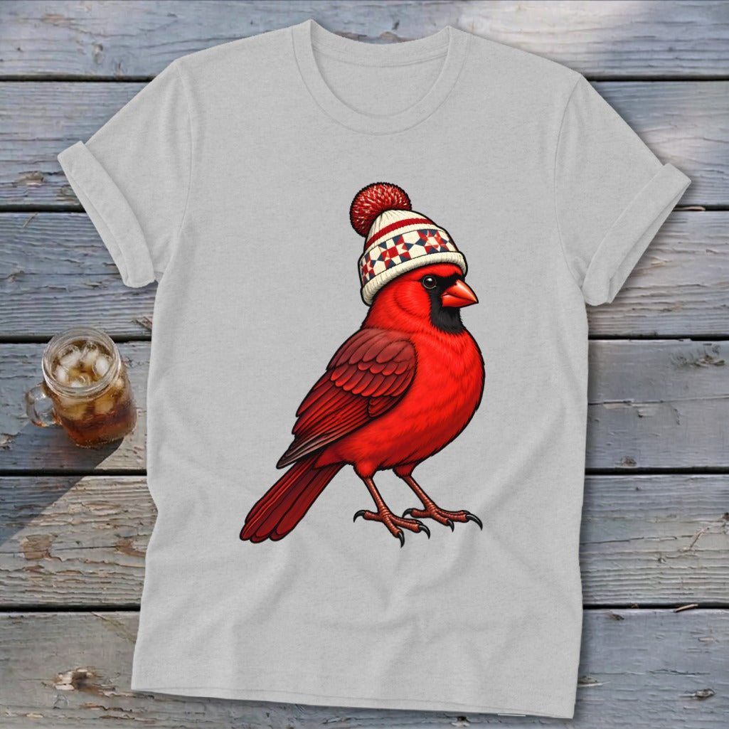 Light gray t-shirt featuring an illustration of a red cardinal wearing a winter beanie.