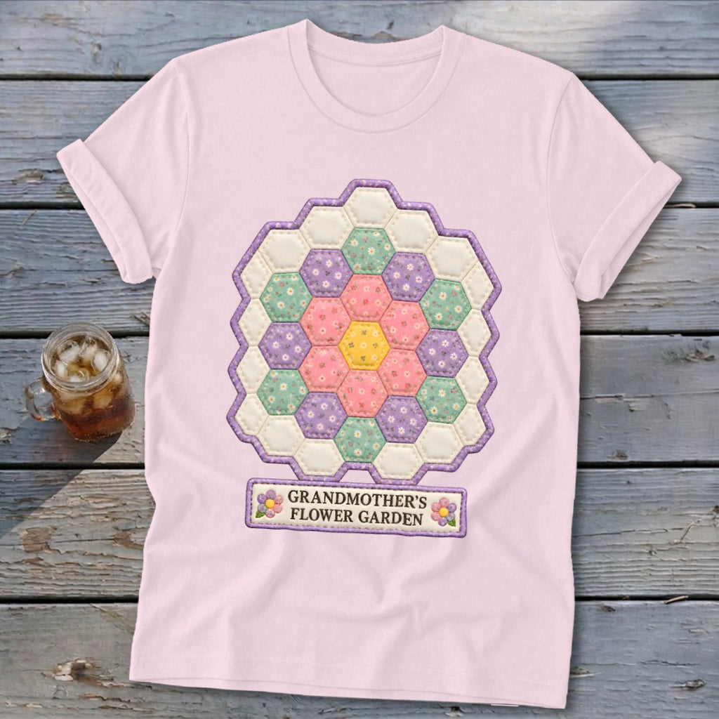 Pink t-shirt with a hexagon floral quilt design and "Grandmother's Flower Garden" text.