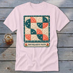 Pink t-shirt with a Drunkard's Path quilt design and text.