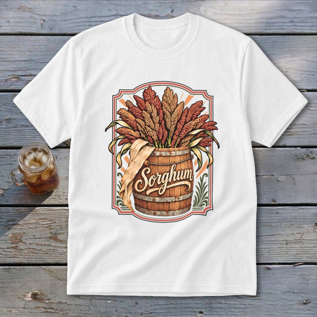 White t-shirt graphic with a wooden barrel overflowing with sorghum stalks, text reads "Sorghum."