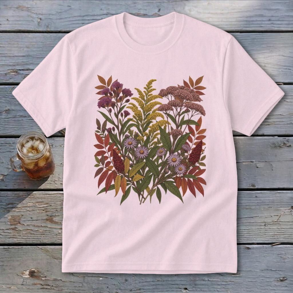 Pink t-shirt with a detailed floral and leaf print featuring purple, yellow, and pink blooms.