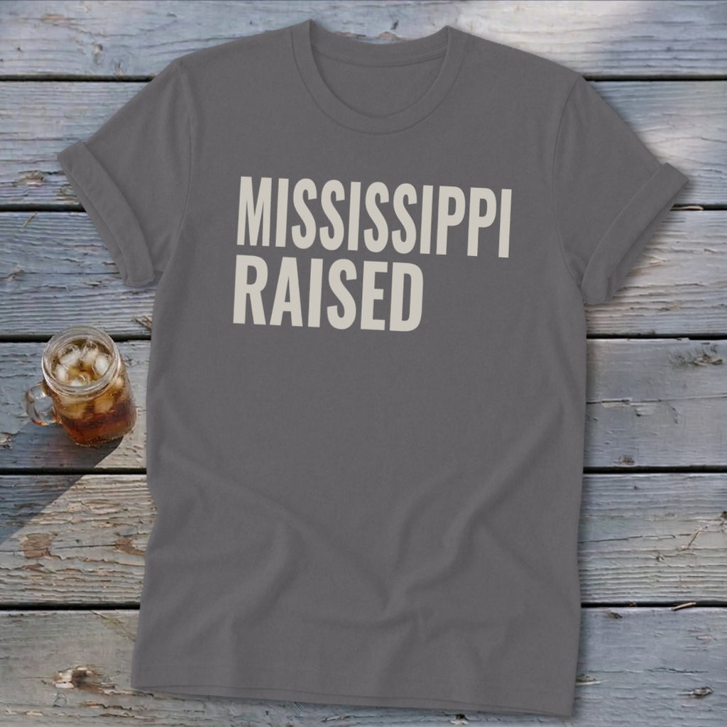 Gray t-shirt with "MISSISSIPPI RAISED" printed in white text.