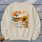 Crewneck sweatshirt with "Small Town Fall Vibes" graphic featuring sunflower and water tower.