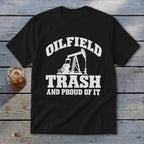 Black t-shirt with white text "Oilfield Trash and Proud of It" and oil pump graphic.