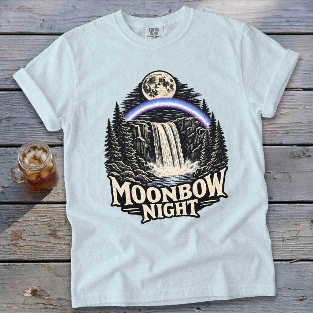 Light blue t-shirt with "Moonbow Night" graphic of a waterfall under a full moon.