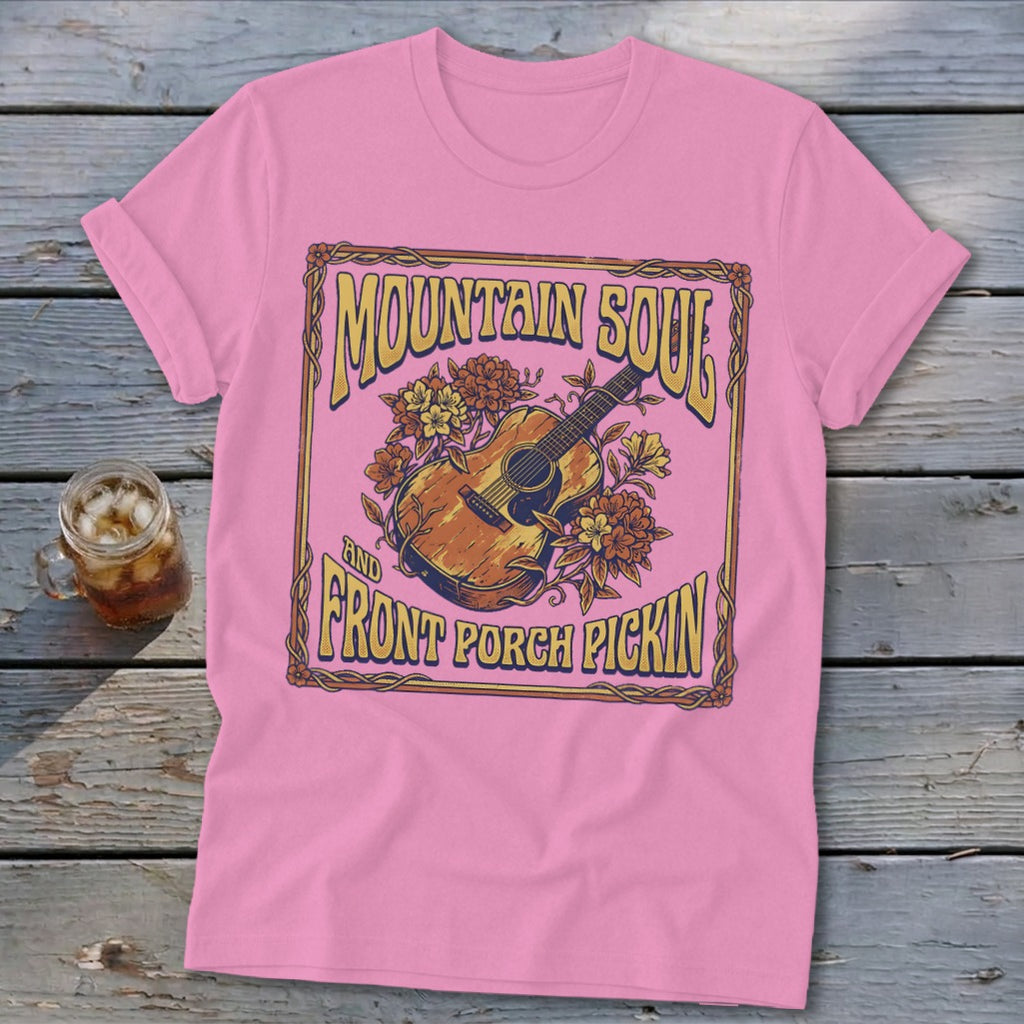 Pink t-shirt with "Mountain Soul And Front Porch Pickin'" text and acoustic guitar graphic.