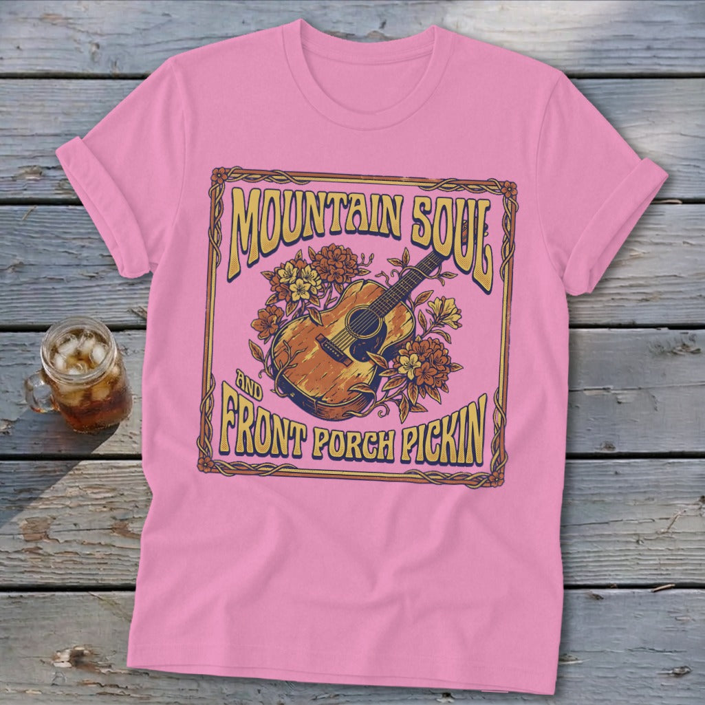 Pink t-shirt with "Mountain Soul And Front Porch Pickin'" text and acoustic guitar graphic.