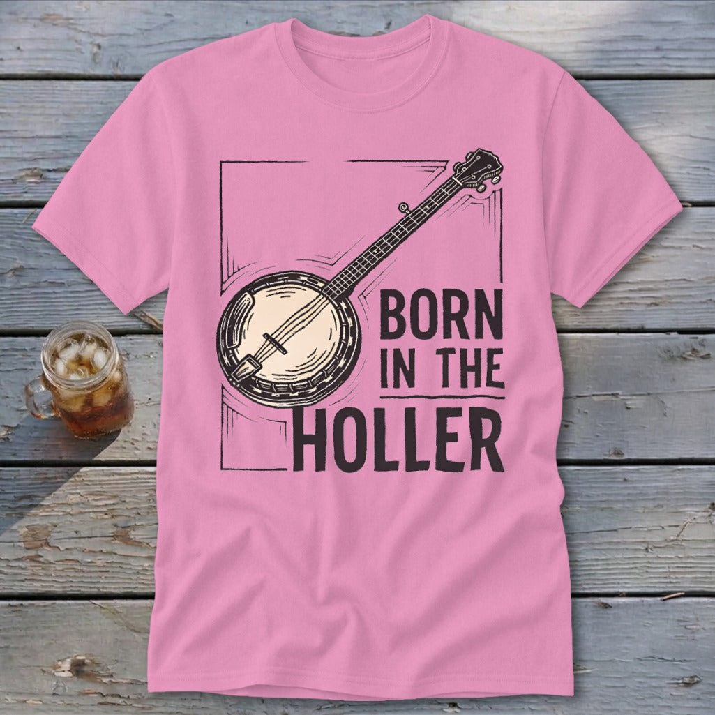 Pink t-shirt with banjo graphic and text "BORN IN THE HOLLER".