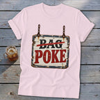 Light pink t-shirt featuring a rustic wooden sign graphic that reads BAG POKE on a wooden background.