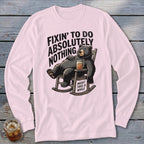 Light pink long-sleeve t-shirt with a graphic of a relaxed bear in a rocking chair holding a drink.