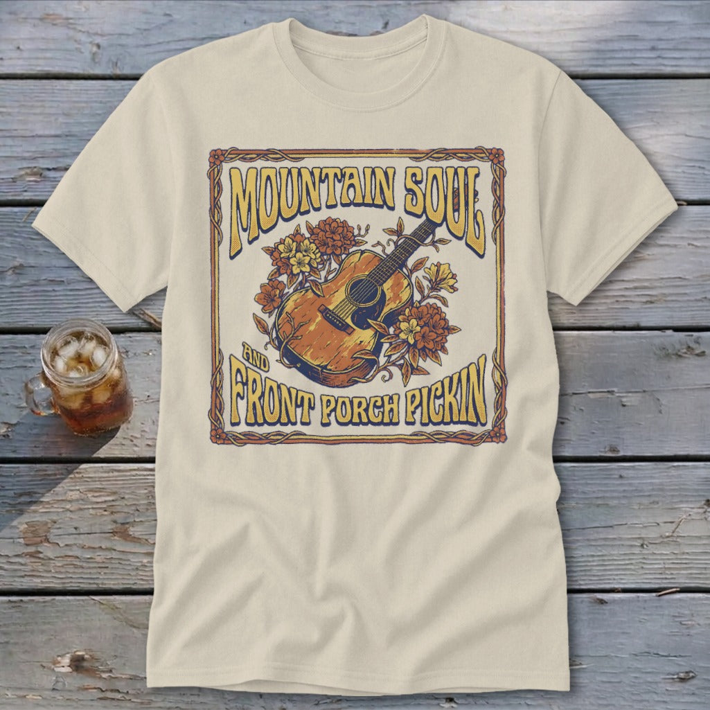 Cream t-shirt with "Mountain Soul and Front Porch Pickin'" graphic featuring an acoustic guitar.