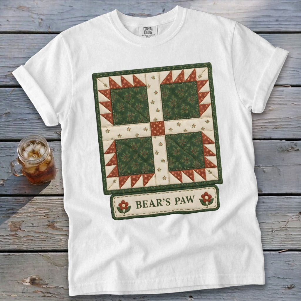 White t-shirt with a green and red quilt patch graphic and "BEAR'S PAW" text.