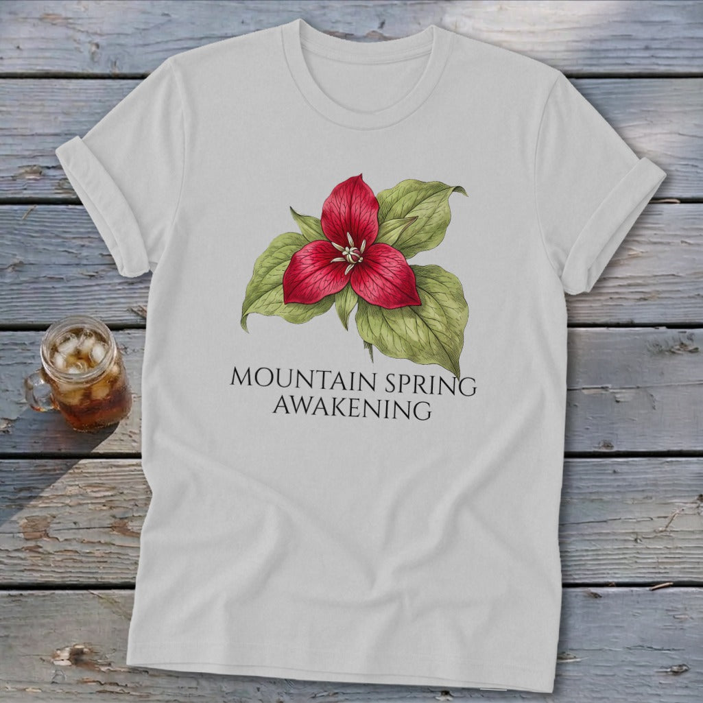 White t-shirt with a red trillium flower graphic and text "MOUNTAIN SPRING AWAKENING".
