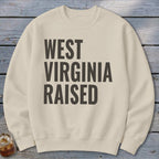 Cream sweatshirt with "West Virginia Raised" printed in dark gray text.