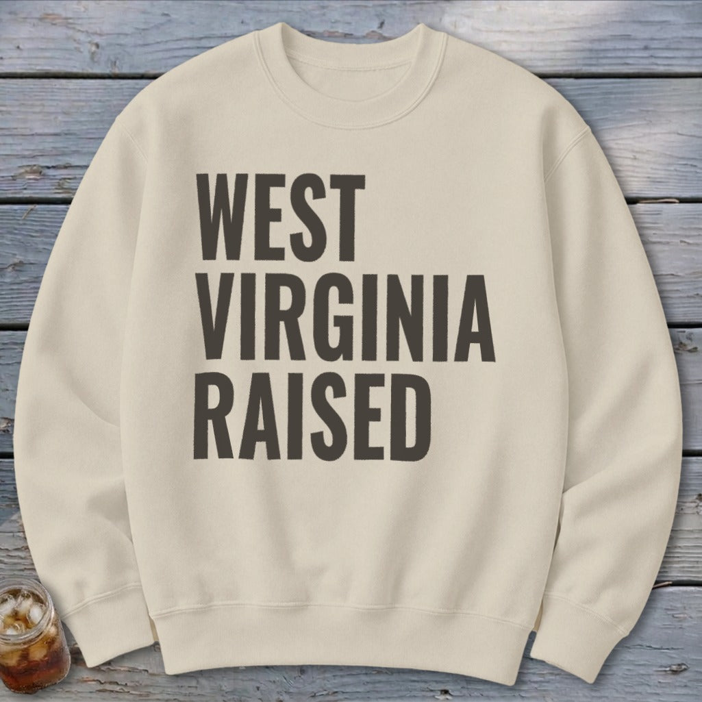 Cream sweatshirt with "West Virginia Raised" printed in dark gray text.