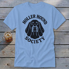 Light blue t-shirt with black "Holler Hound Society" text and dog graphic.