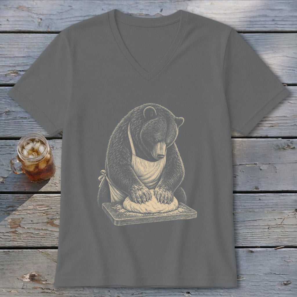 Bear wearing an apron kneading dough on a wooden board, displayed on a grey t-shirt.