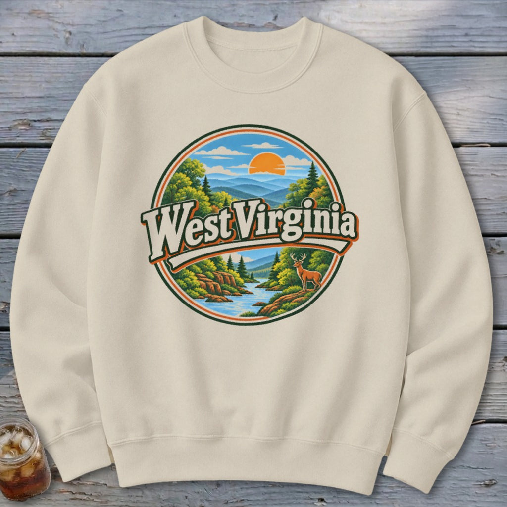 Cream sweatshirt with circular West Virginia graphic featuring mountains, river, deer, and sun.