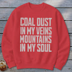 Red crewneck sweatshirt with the white distressed text COAL DUST IN MY VEINS MOUNTAINS IN MY SOUL.