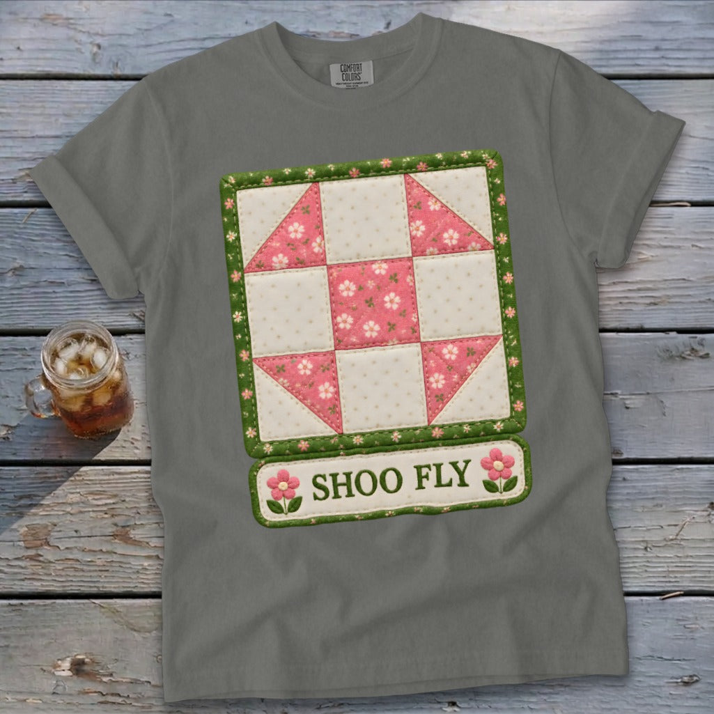 Gray t-shirt with a pink and white floral quilt block design that reads "SHOO FLY".