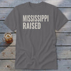 Grey t-shirt with "MISSISSIPPI RAISED" text in white lettering.