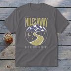Gray t-shirt with "Miles Away But Mountain Bound" text and mountain design.