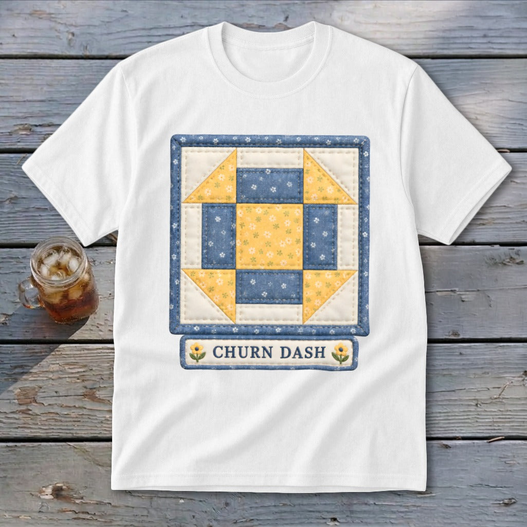 White t-shirt with a Churn Dash quilt block design and text.