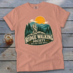 Peach t-shirt with "Ridge Walking Society" graphic featuring a hiker and mountains.